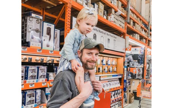Searching for supplies for a project at Home Depot. Eliana loves helping out and designing things to build with Dan.