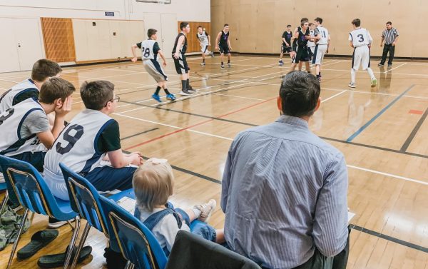 Coaching the boys' basketball team with Eliana by his side. The kids love having our girls join and are so sweet with them.