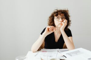 Expectant mother considering the importance of compassionate support when making an adoption decision.