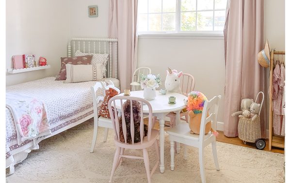 Eliana's room where the girls like to play with their toy kitchen, dress up, or have tea parties