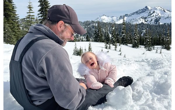 Dan loves playing in the snow & building igloos with our girls.